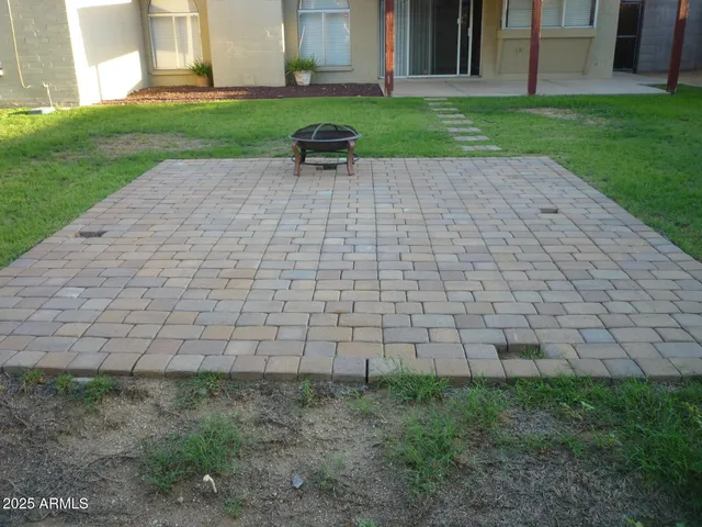 a view of yard with seating area and trees