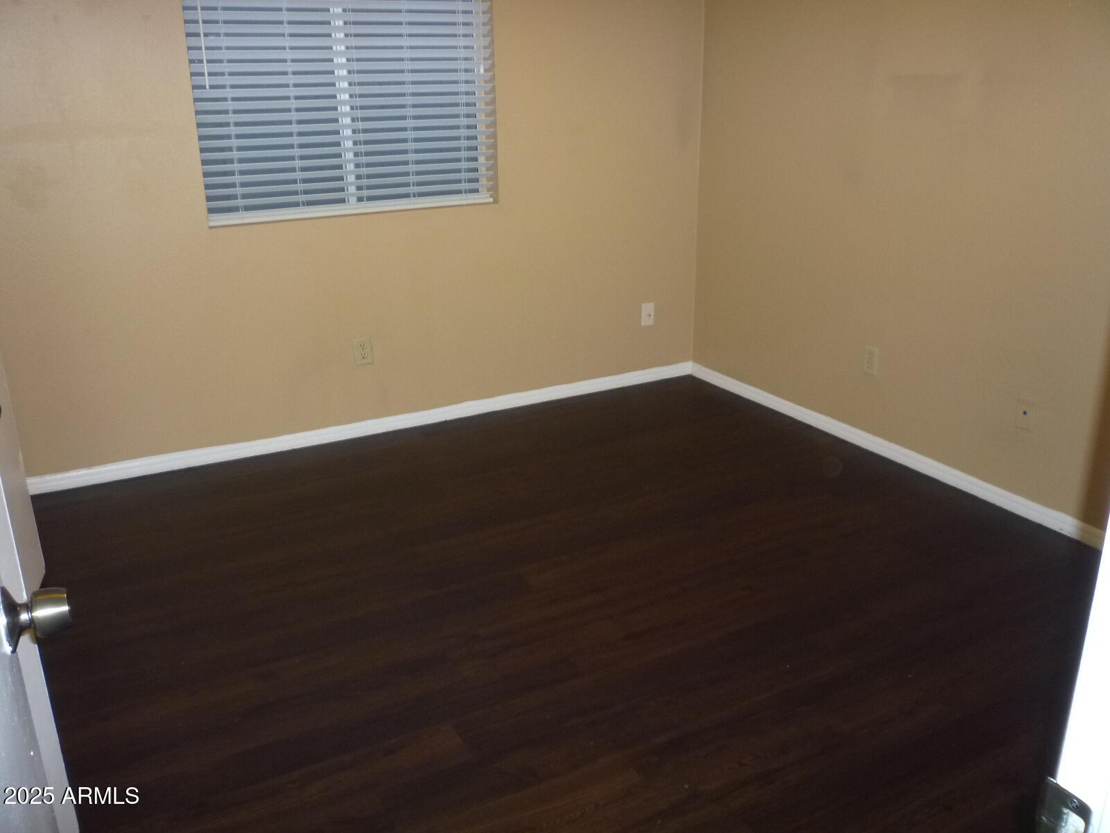 4216 West Willow Avenue Phoenix, AZ 85029 - Photo 10 of 14 a view of a small space with wooden floor and a window
