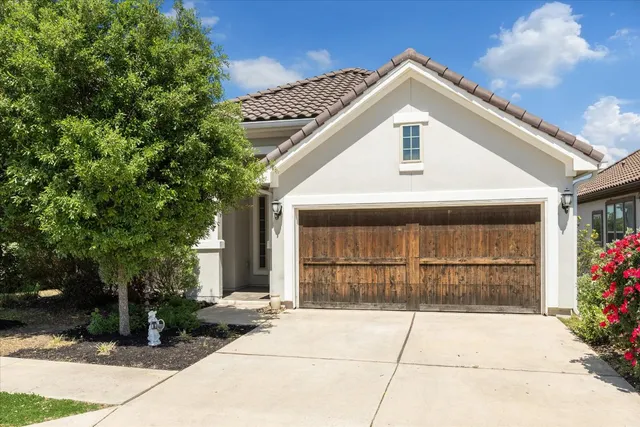 a front view of a house with a garage