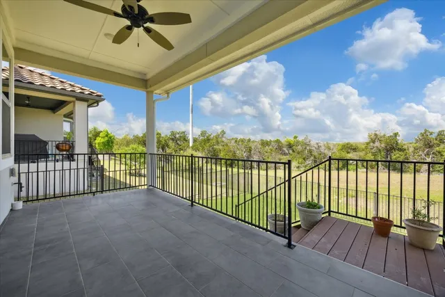 a view of a balcony with a floor to ceiling window in the balcony
