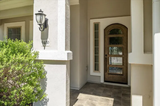a front view of a house with a glass door