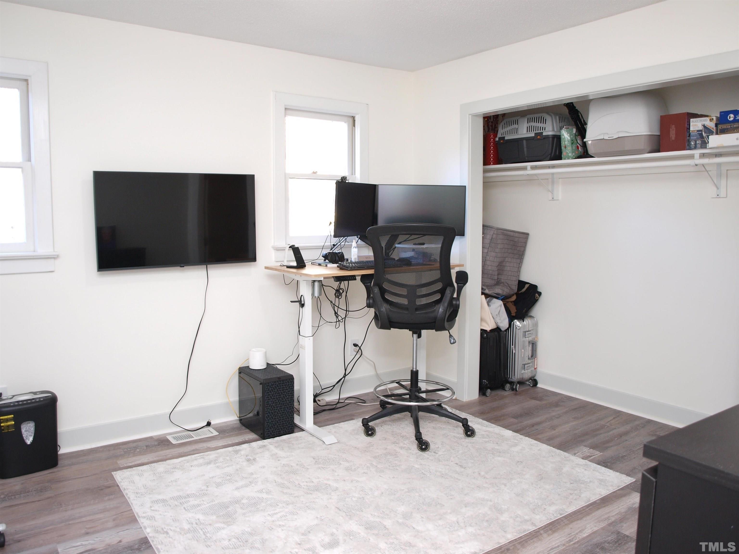 1424 Quarter Point Raleigh, NC 27615 - Photo 14 of 18 a work room with furniture and a flat screen tv