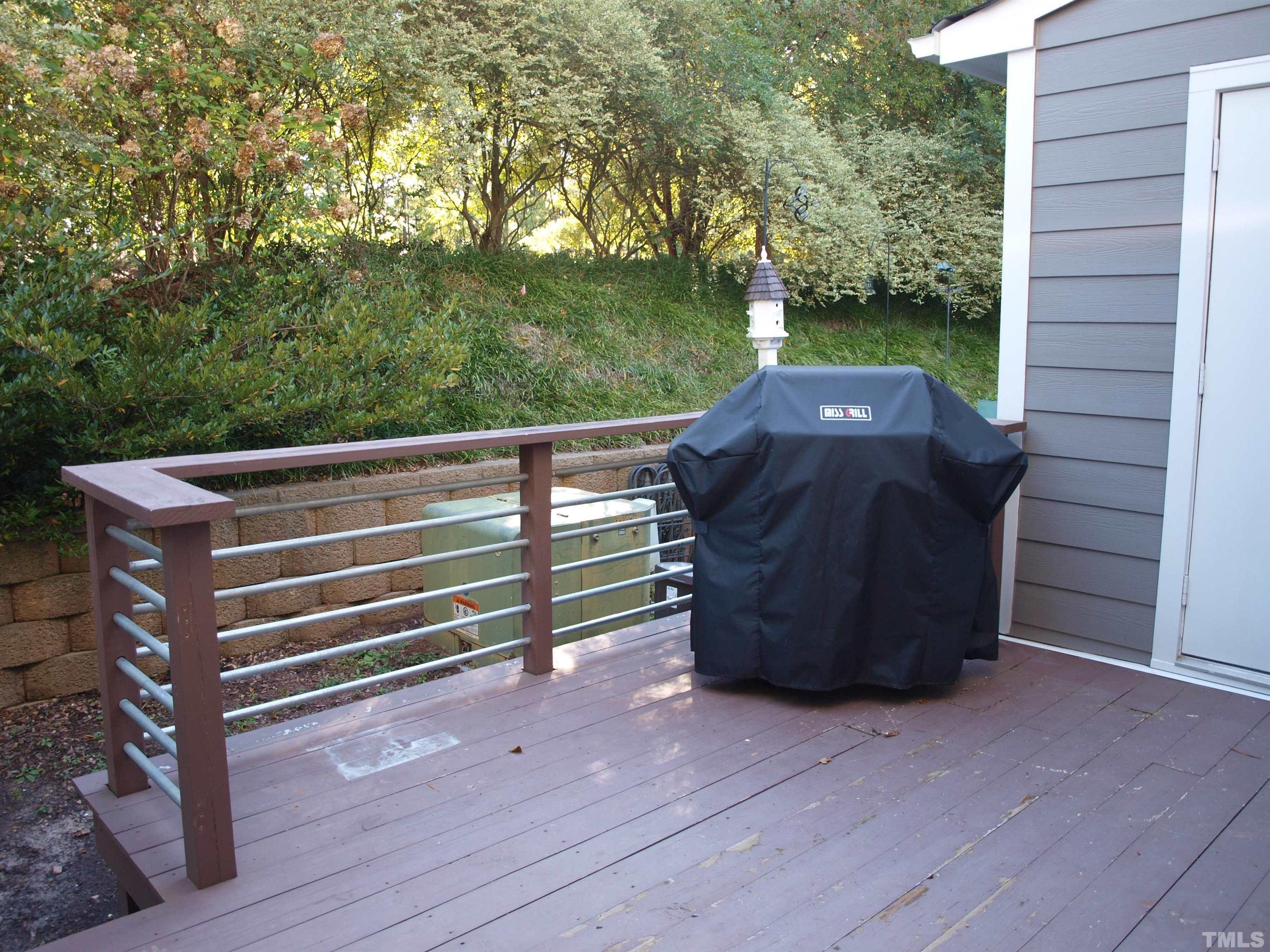 1424 Quarter Point Raleigh, NC 27615 - Photo 18 of 18 a view of a bench in a back yard