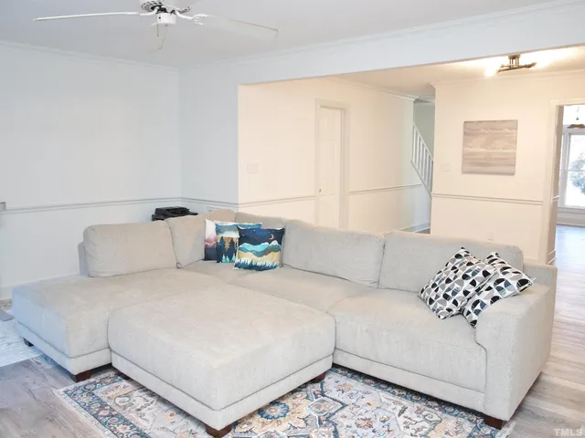 a bedroom with a large bed and a couch