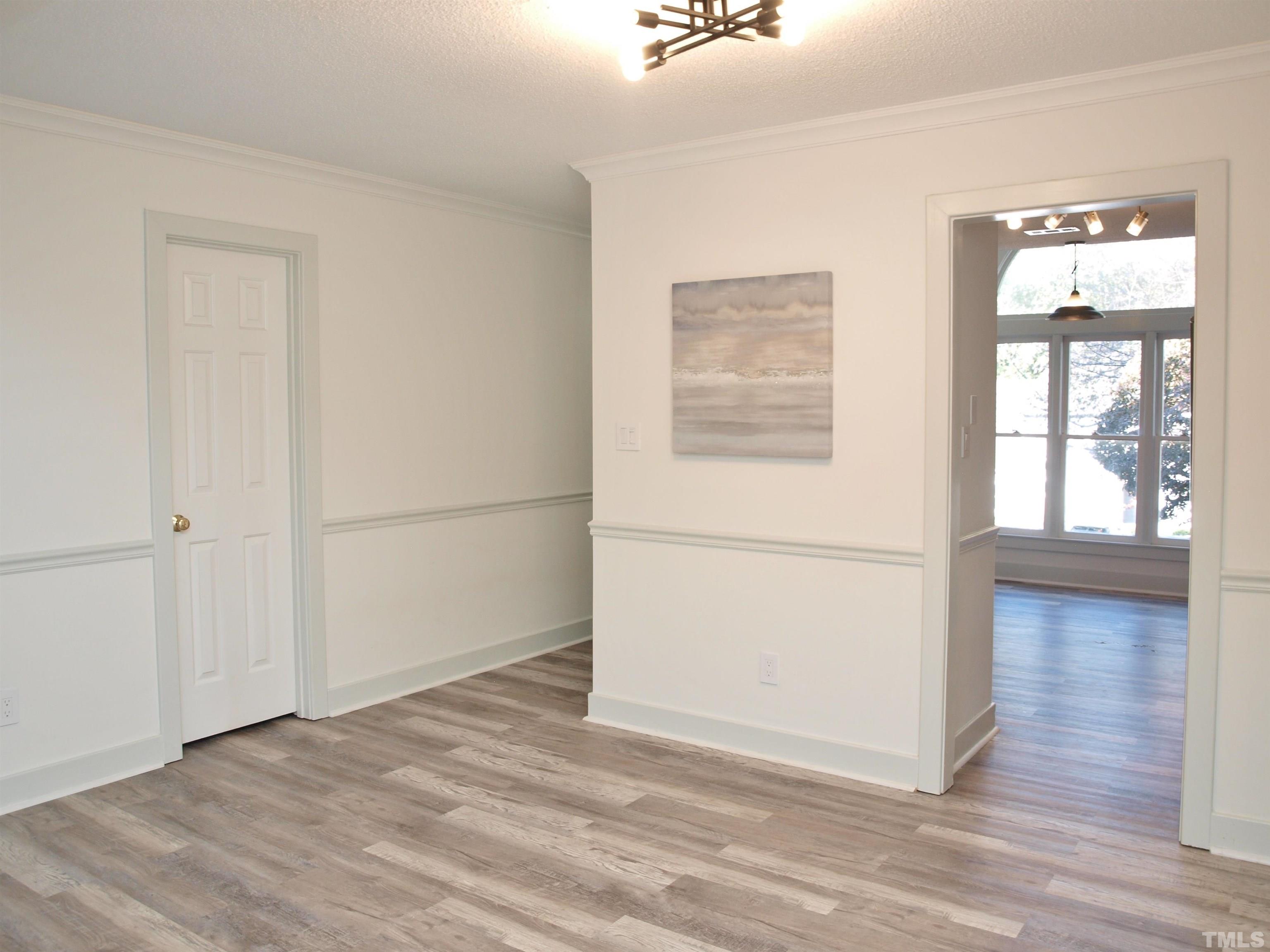 1424 Quarter Point Raleigh, NC 27615 - Photo 10 of 18 a view of a room with wooden floor and window