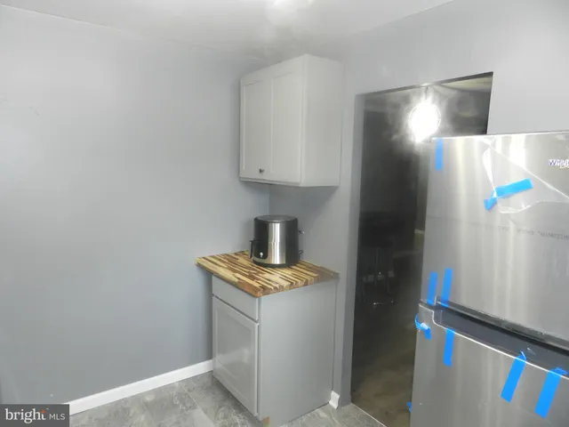 a room with cabinets and a window