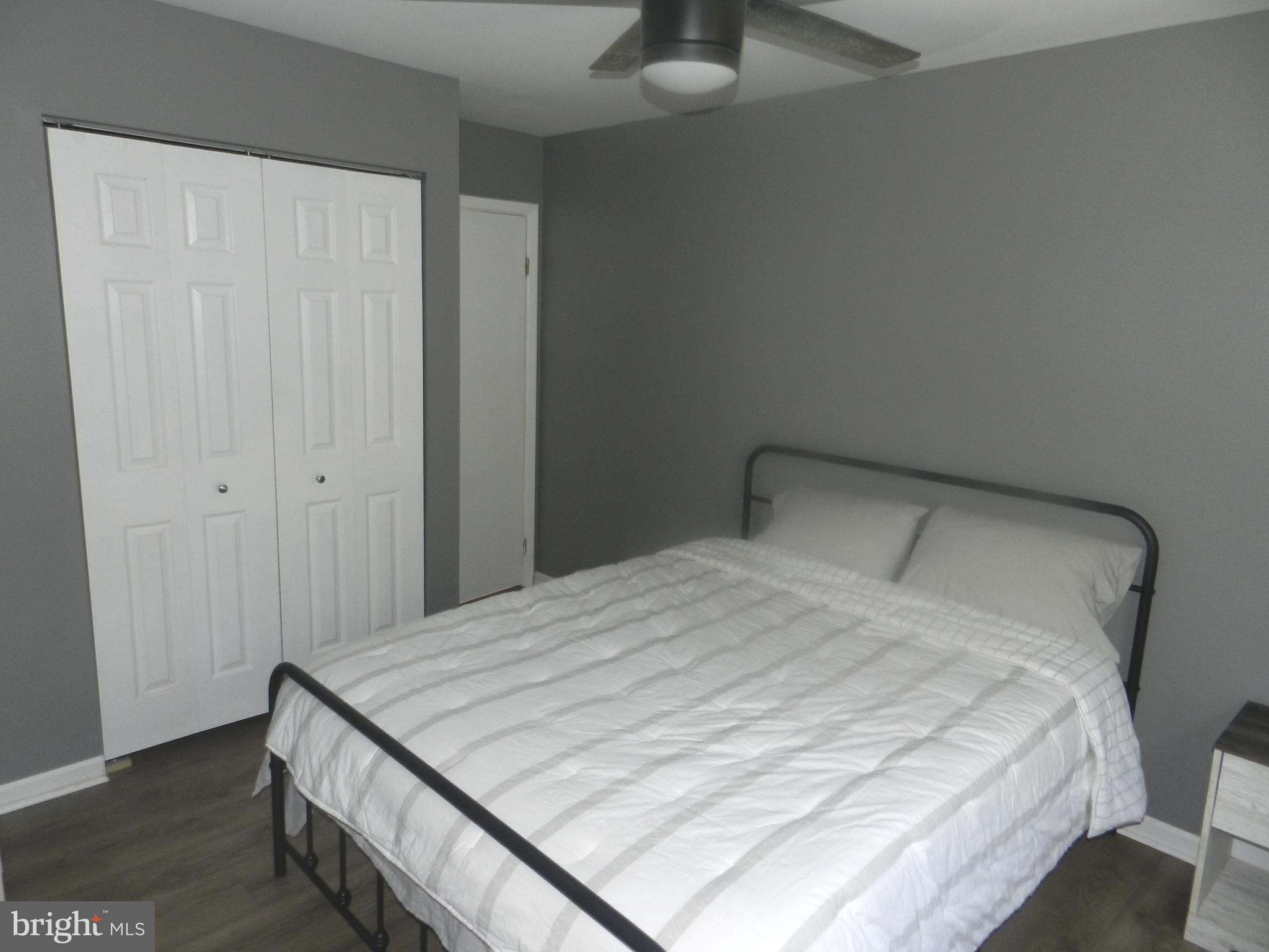 3714 Mayberry Avenue, Unit E Baltimore, MD 21206 - Photo 12 of 28 a bedroom with a bed and a window