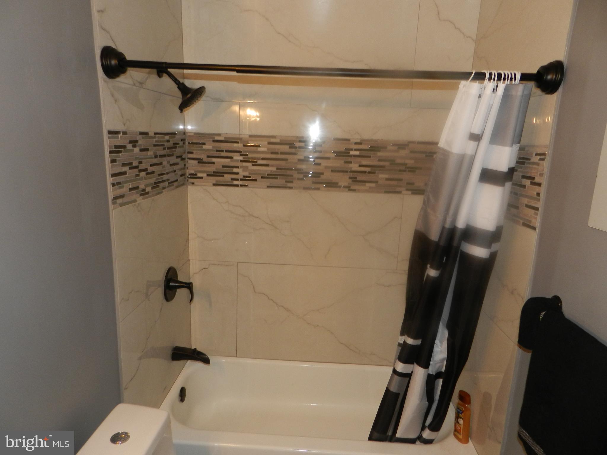 3714 Mayberry Avenue, Unit E Baltimore, MD 21206 - Photo 22 of 28 a bathroom with a shower