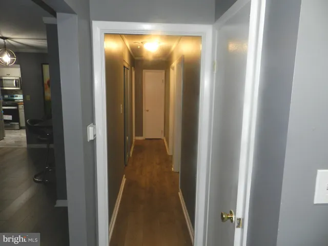 a view of a bathroom from a hallway