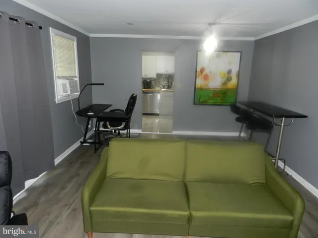 a room with pool table and a window