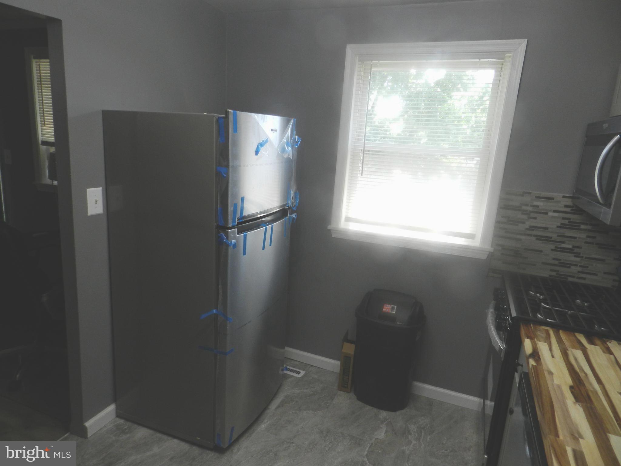 3714 Mayberry Avenue, Unit E Baltimore, MD 21206 - Photo 10 of 28 a bathroom with a light fixture and a window