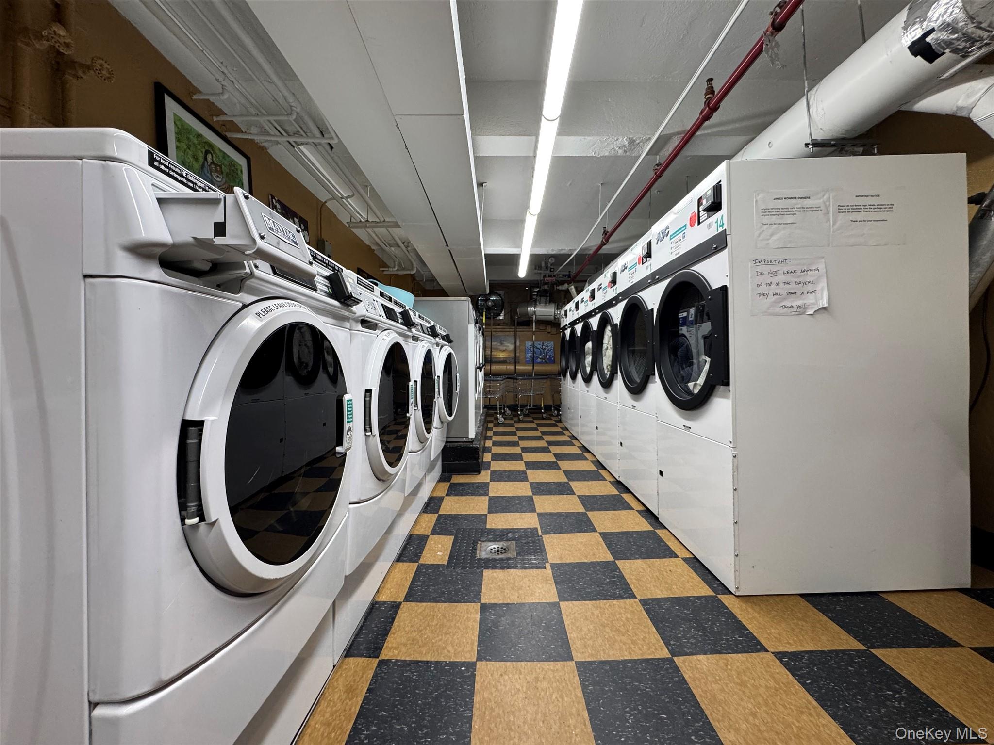 104-20 68th Drive, Unit B19 Queens, NY 11375 - Photo 12 of 15 a view of a utility room with a washer and dryer