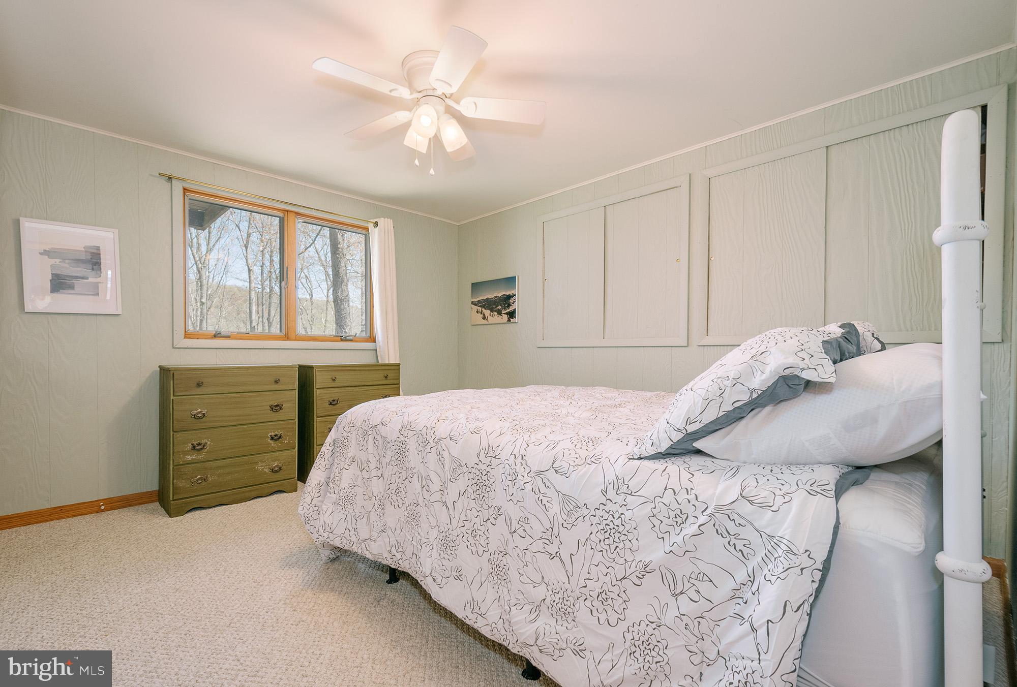 1723 Marsh Hill Road McHenry, MD 21541 - Photo 11 of 40 a bedroom with a bed and a window