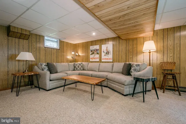 a bedroom with furniture and a flat screen tv