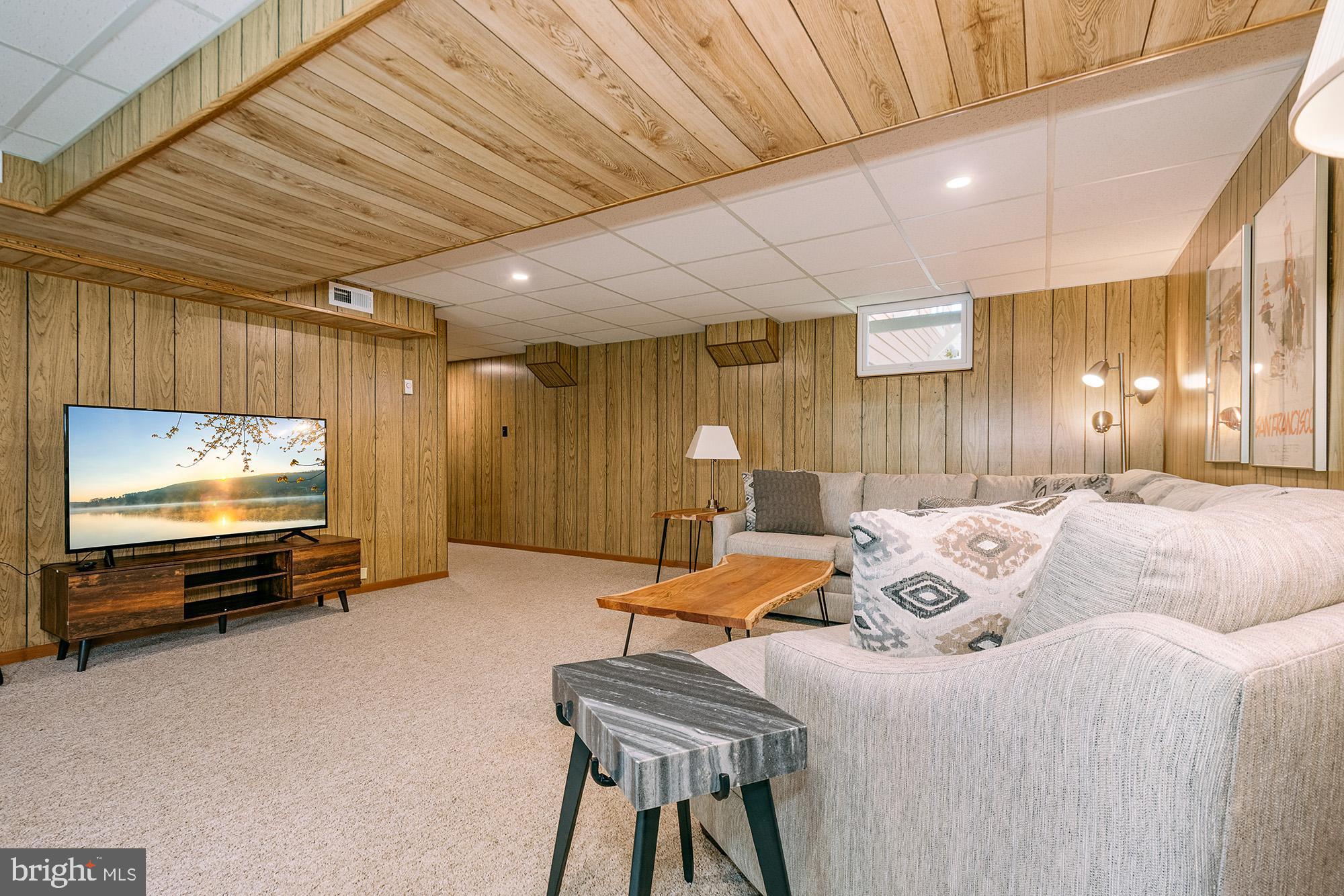 1723 Marsh Hill Road McHenry, MD 21541 - Photo 24 of 40 a bedroom with furniture and a flat screen tv