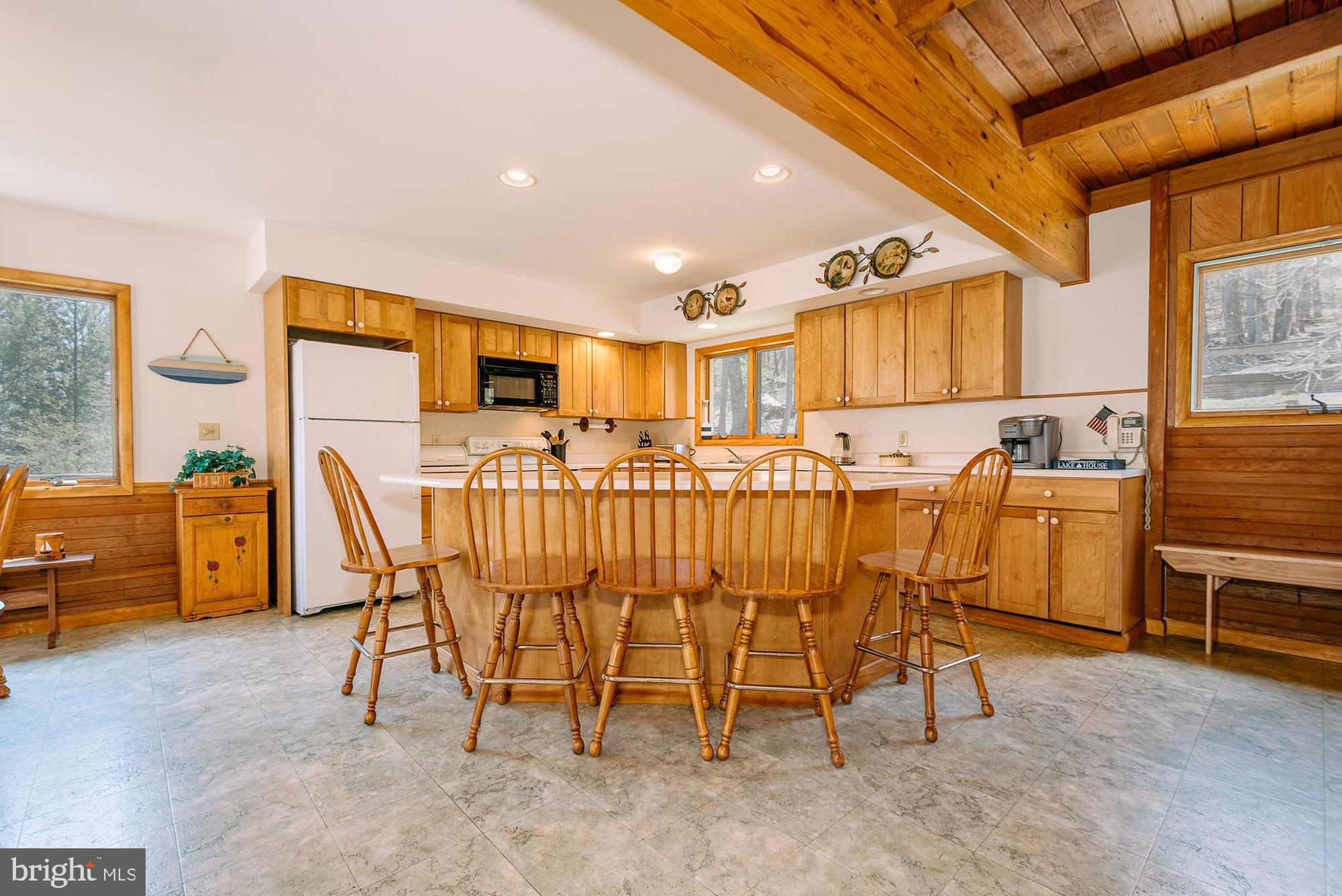 1723 Marsh Hill Road McHenry, MD 21541 - Photo 3 of 40 a dining room with furniture and a kitchen view