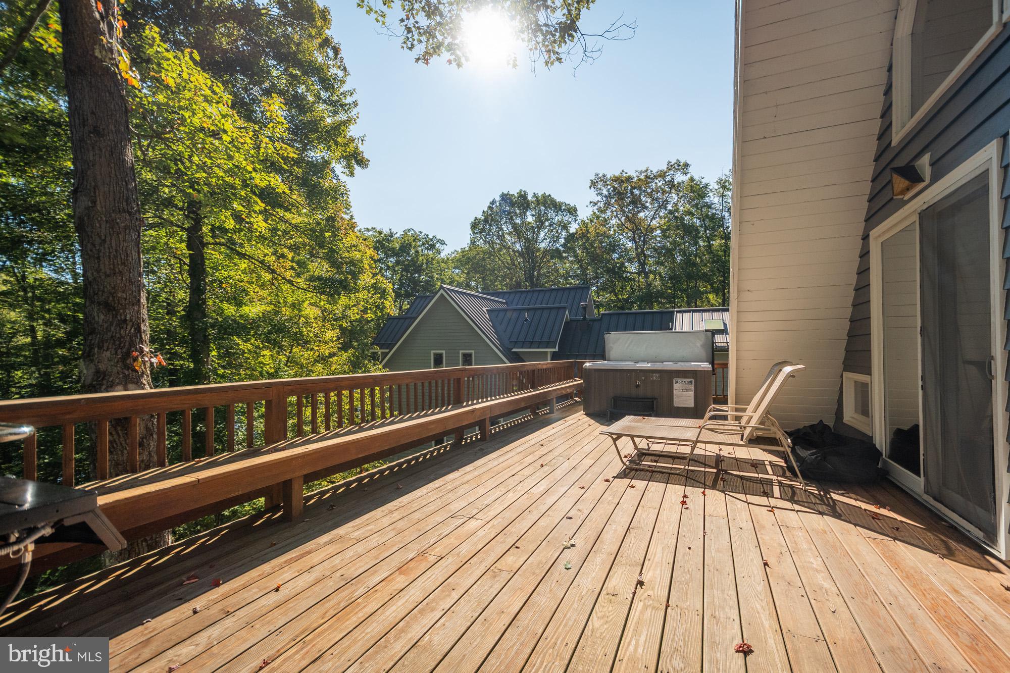 1723 Marsh Hill Road McHenry, MD 21541 - Photo 40 of 40 a view of balcony with wooden floor and outdoor seating