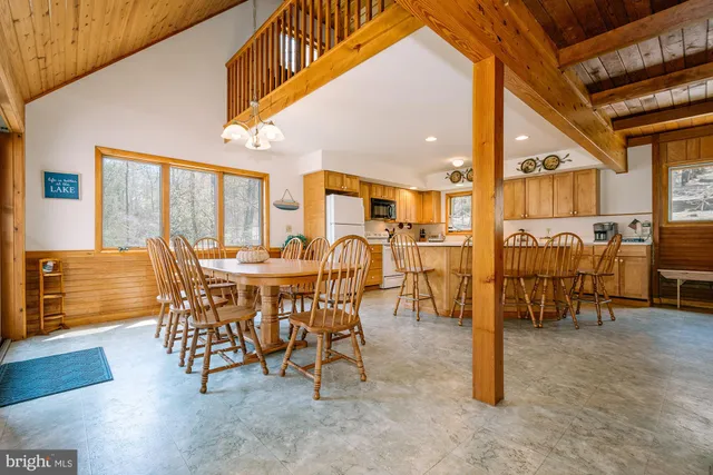 a dining room with furniture and a view of dining room