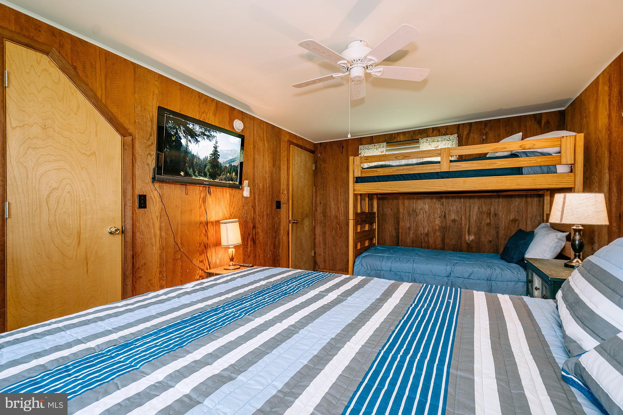 1723 Marsh Hill Road McHenry, MD 21541 - Photo 9 of 40 a bedroom with a bed and wooden floor