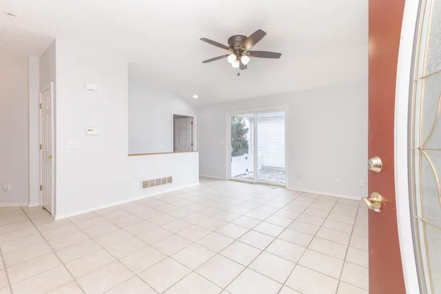 a view of an empty room and window