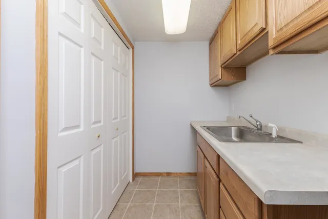 a kitchen with a sink and cabinets