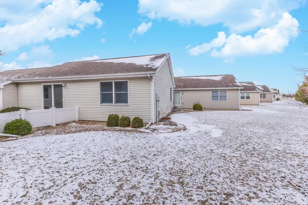 a front view of a house with a large window