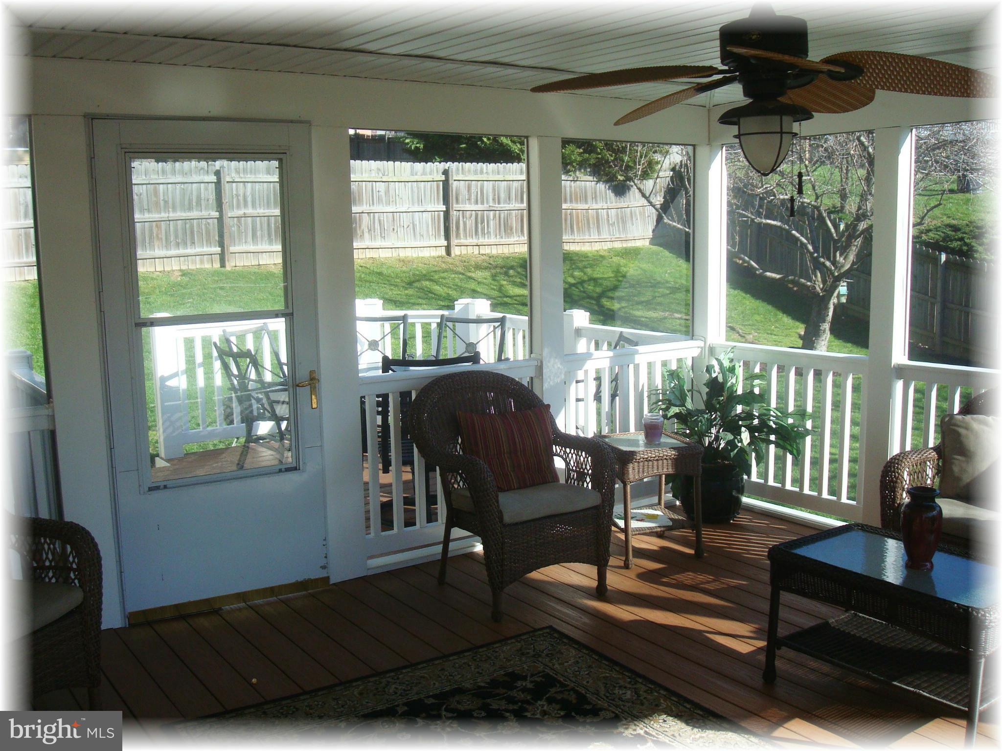 9010 Throgmorton Road Baltimore, MD 21234 - Photo 15 of 30 Porch opens to the sun deck for outdoor grilling.