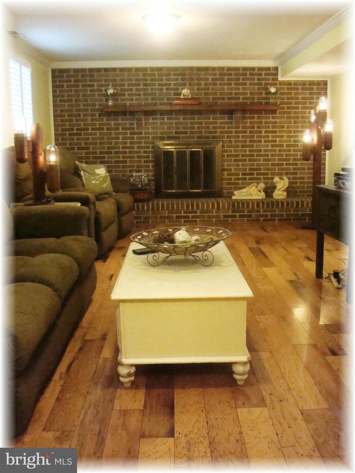 9010 Throgmorton Road Baltimore, MD 21234 - Photo 23 of 30 Family Rm offers hickory wood floors.