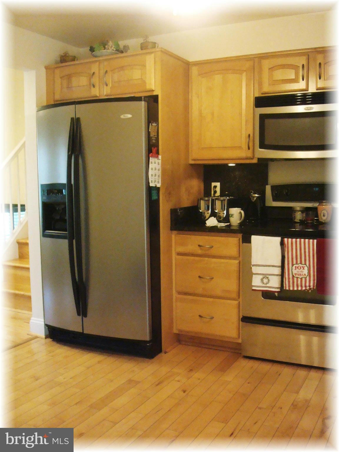 9010 Throgmorton Road Baltimore, MD 21234 - Photo 10 of 30 Gleaming maple floors & raised panel cabinetry.