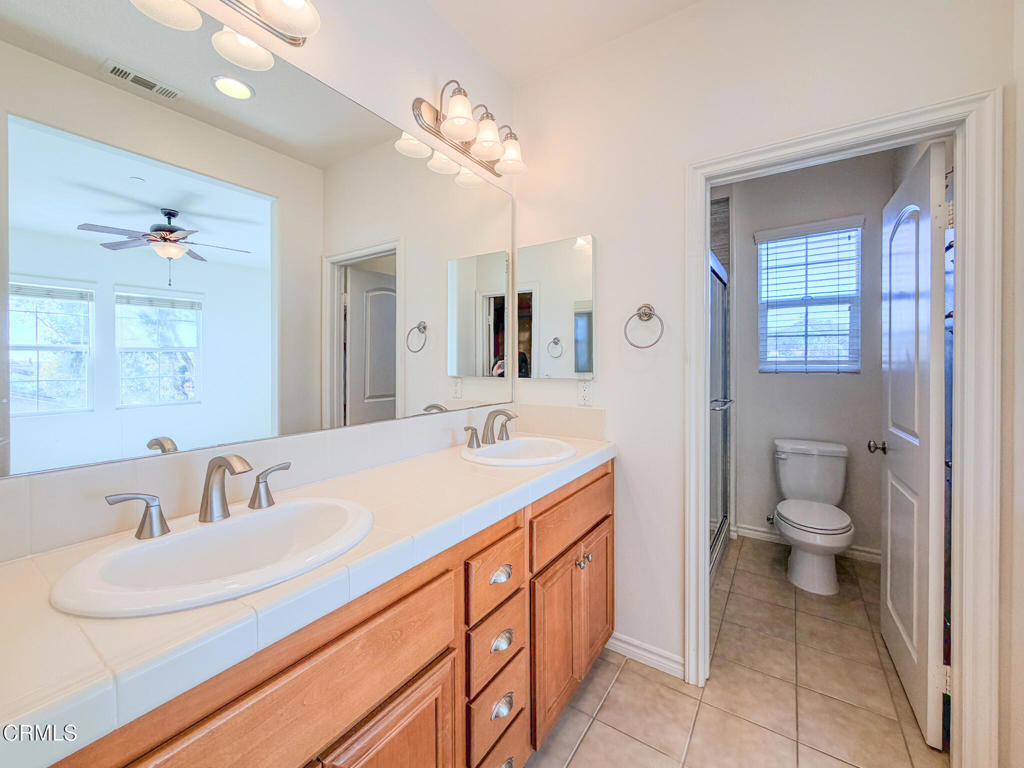 8262 Onyx Street Ventura, CA 93004 - Photo 20 of 33 a bathroom with a sink and a mirror