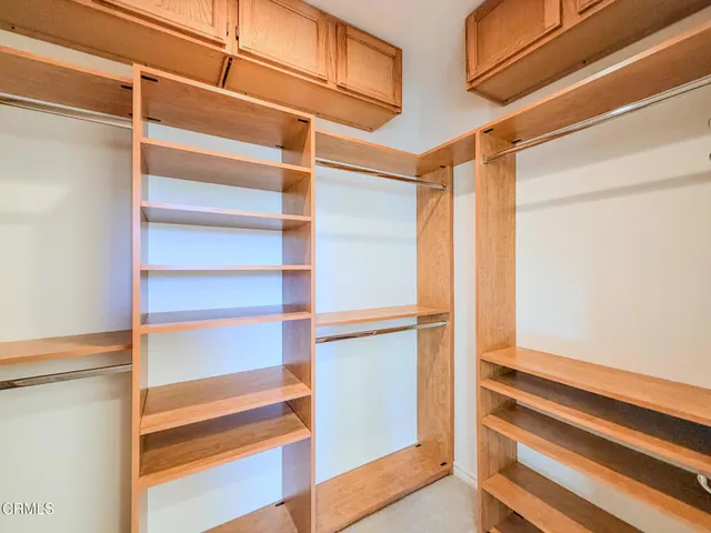a view of a hallway with washer and dryer