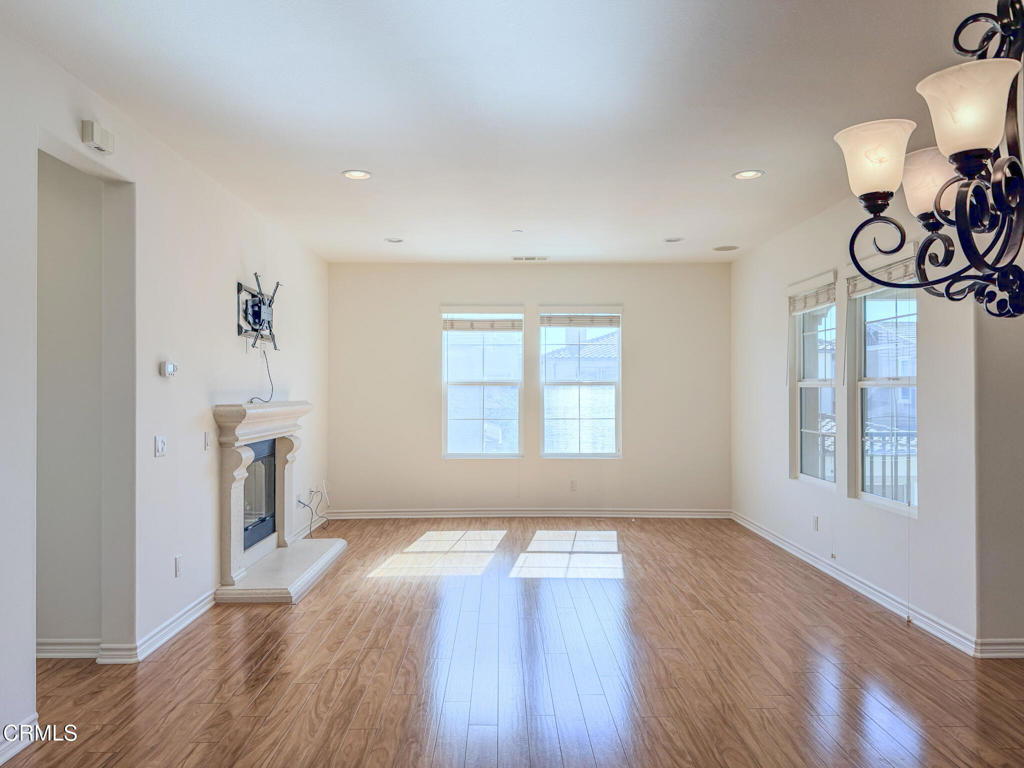8262 Onyx Street Ventura, CA 93004 - Photo 7 of 33 a view of empty room with wooden floor and fan