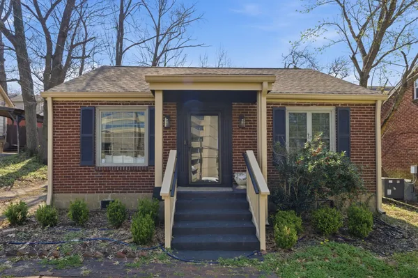 a front view of a house with stairs