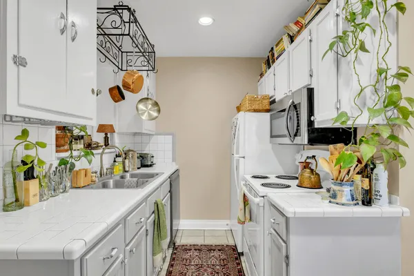 a kitchen with a sink and refrigerator