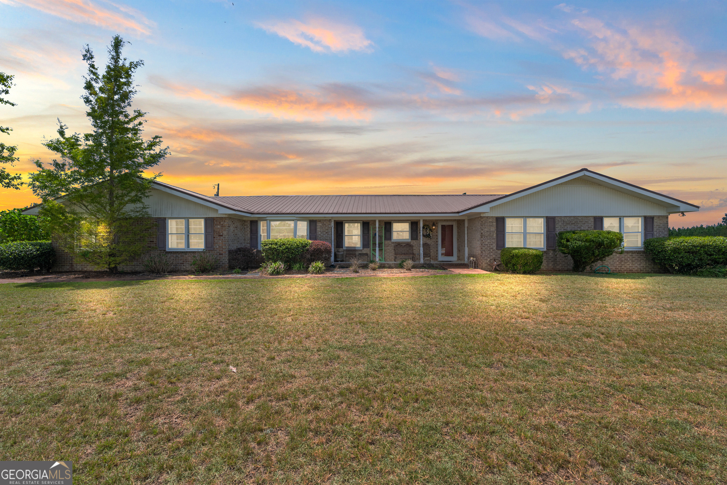 a view of a house with a swimming pool with a yard