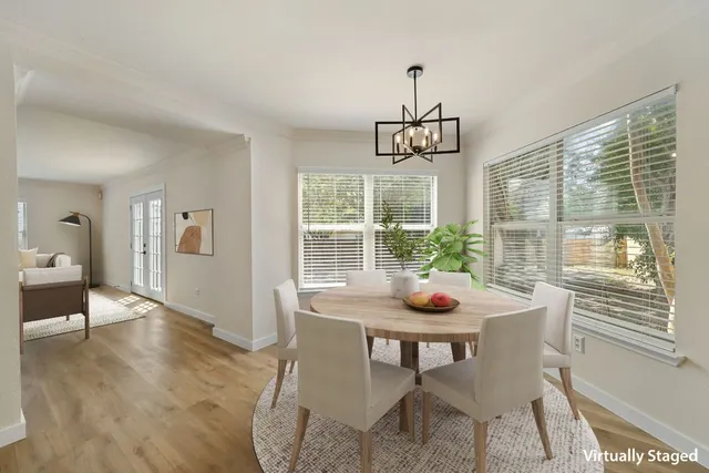 a dining room with furniture window wooden floor