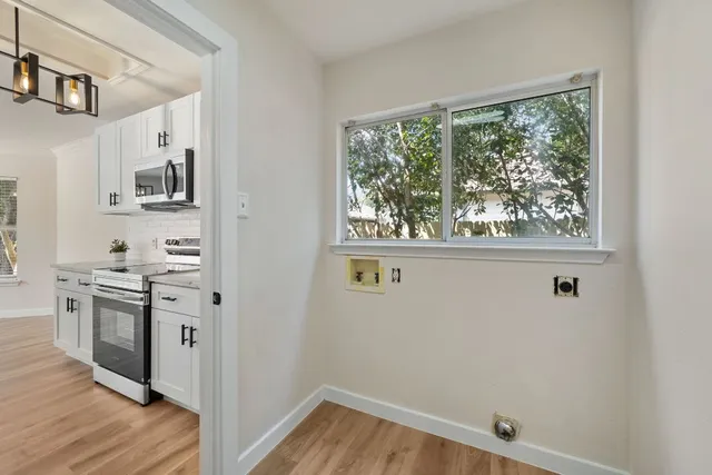 a kitchen with a refrigerator and a sink