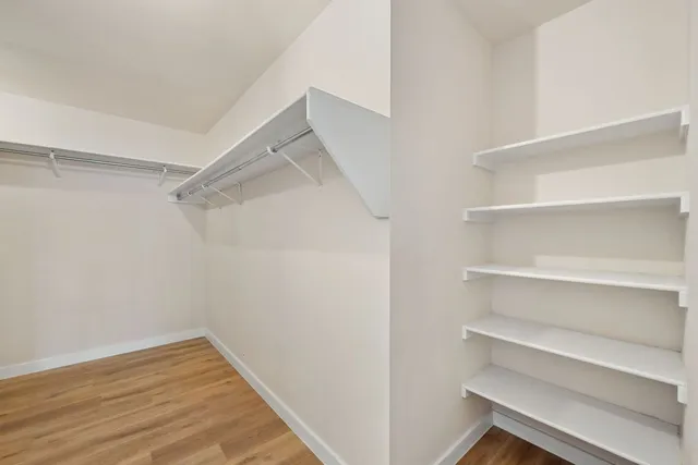a view of an empty walk in closet