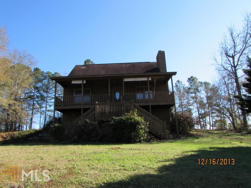 60 Dukes Road Franklin, GA 30217 - Photo 1 of 1 a front view of a house with a garden