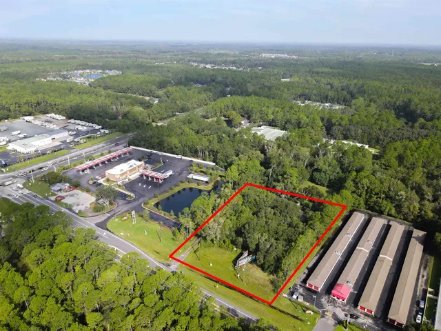 a view of a large building with a flower garden