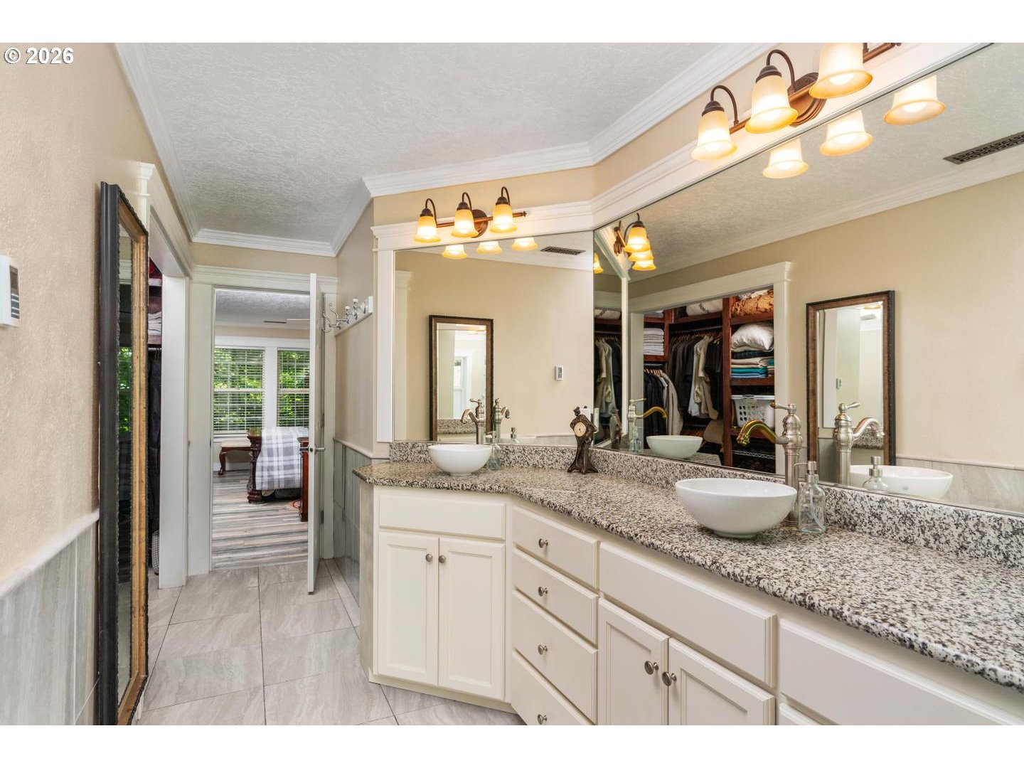 16042 Southwest Waxwing Way Beaverton, OR 97007 - Photo 25 of 48 a bathroom with a granite countertop sink and a mirror