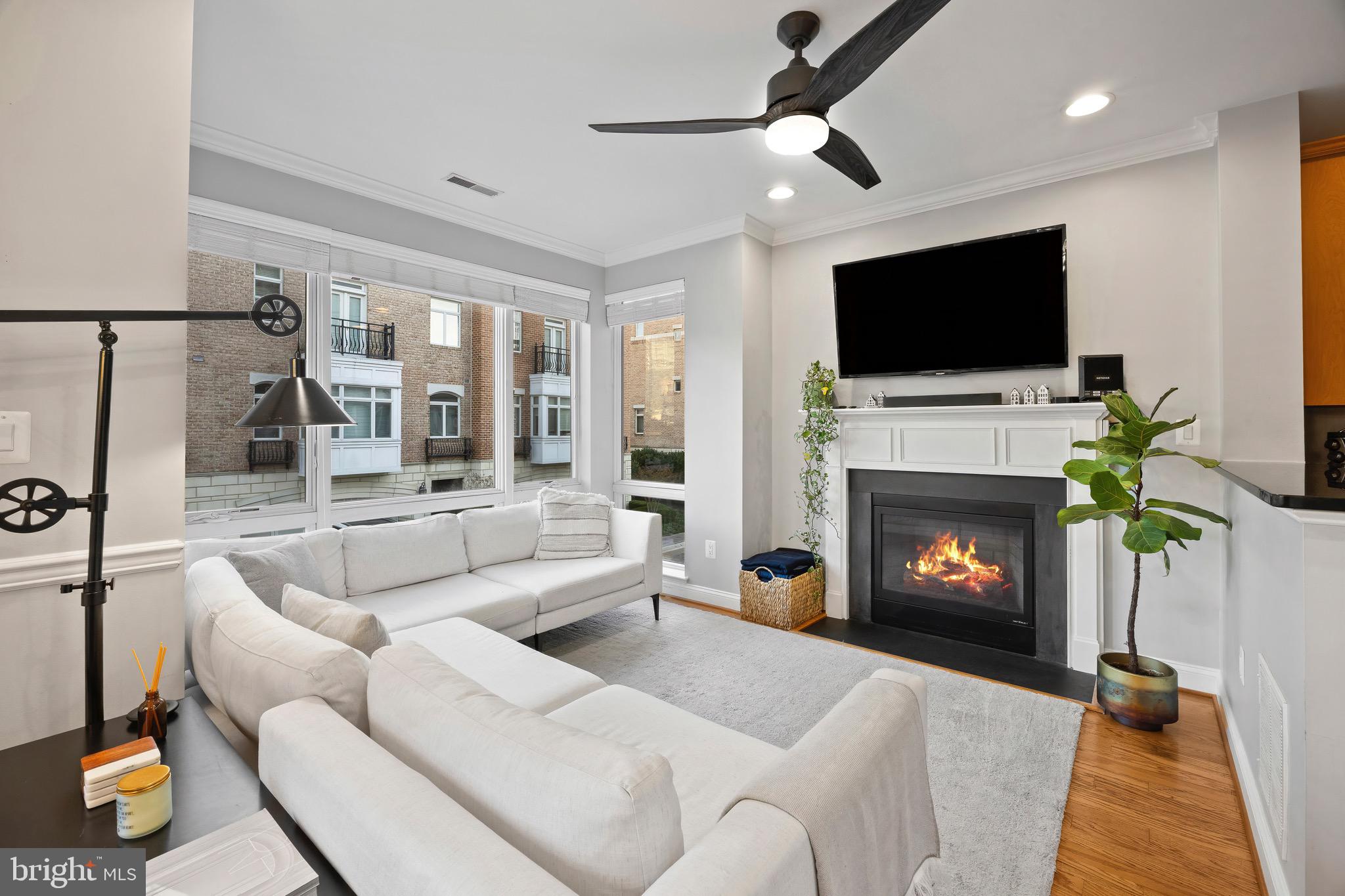 900 Valencia Court, Unit 188 Baltimore, MD 21230 - Photo 24 of 62 a living room with furniture a flat screen tv and a fireplace