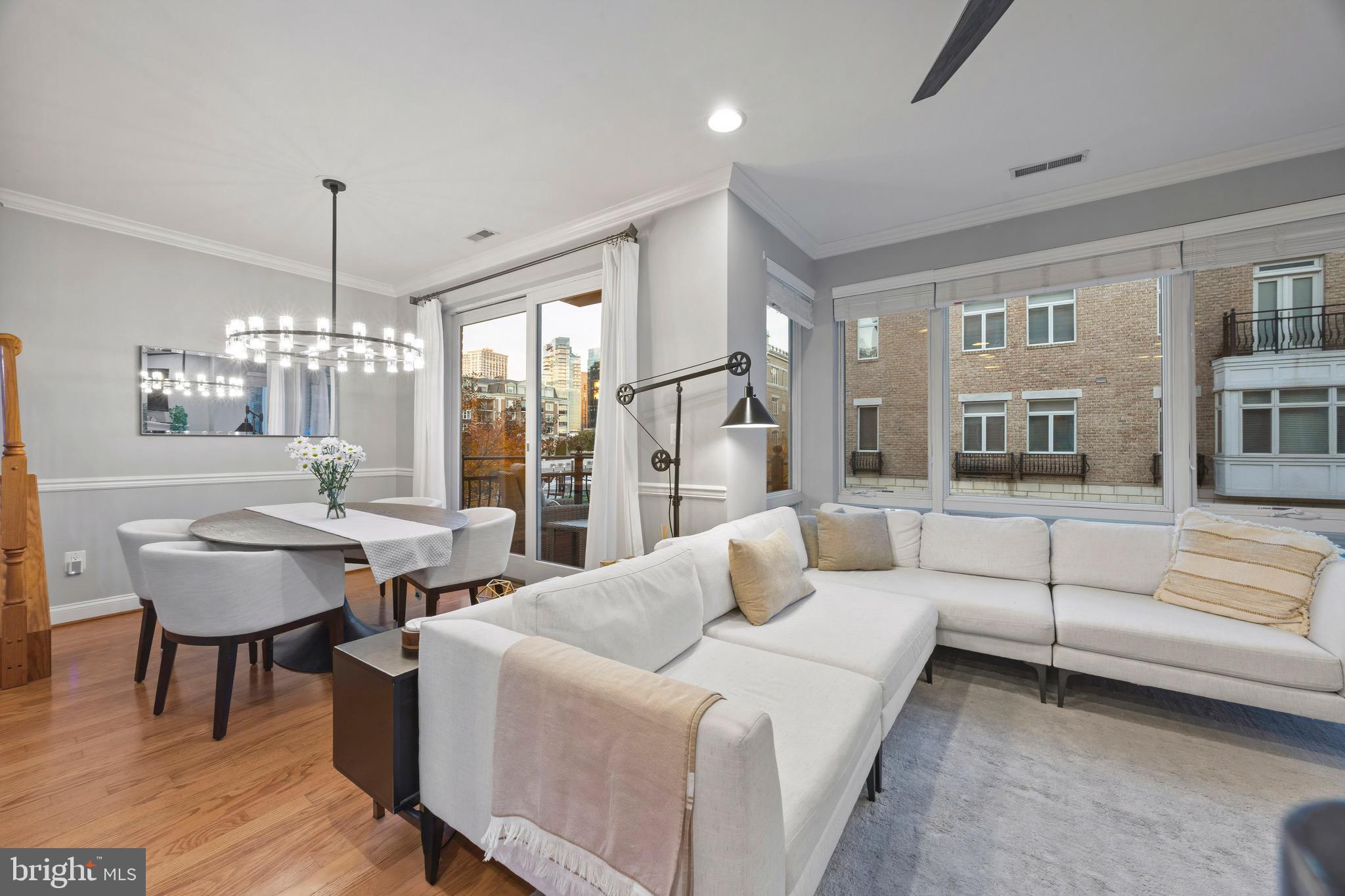 900 Valencia Court, Unit 188 Baltimore, MD 21230 - Photo 25 of 62 a living room with furniture and a chandelier