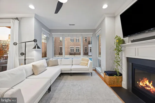 a bedroom with a bed a couch and dresser