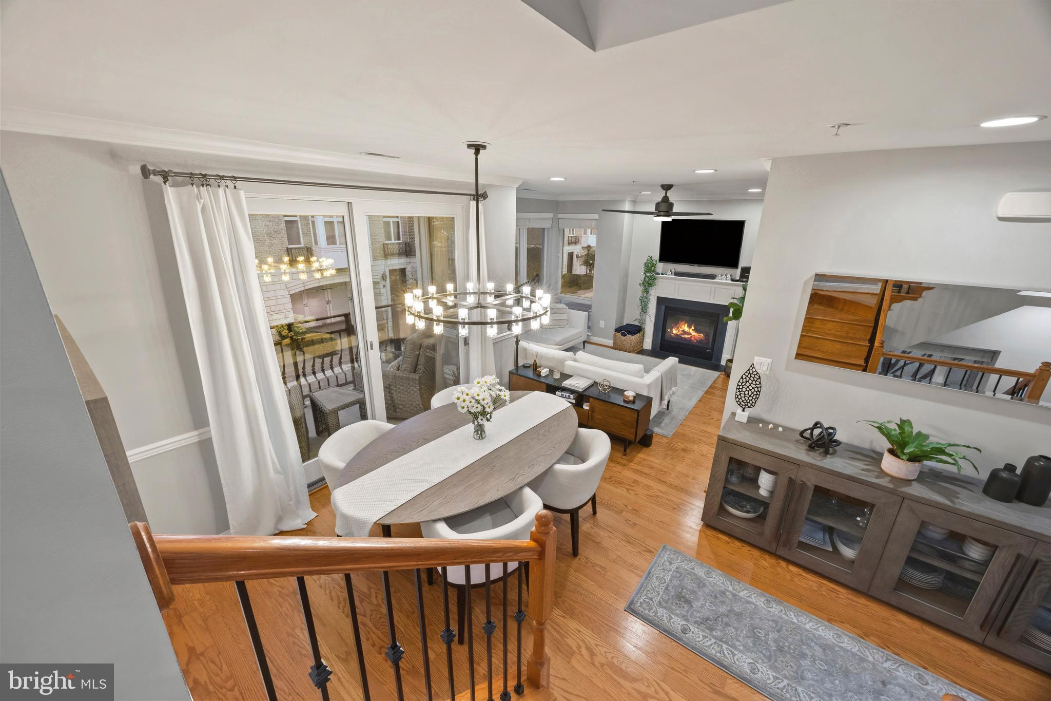 900 Valencia Court, Unit 188 Baltimore, MD 21230 - Photo 29 of 62 a living room with furniture a flat screen tv and a floor to ceiling window