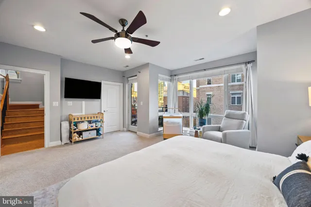 a bedroom with a bed and a night stand