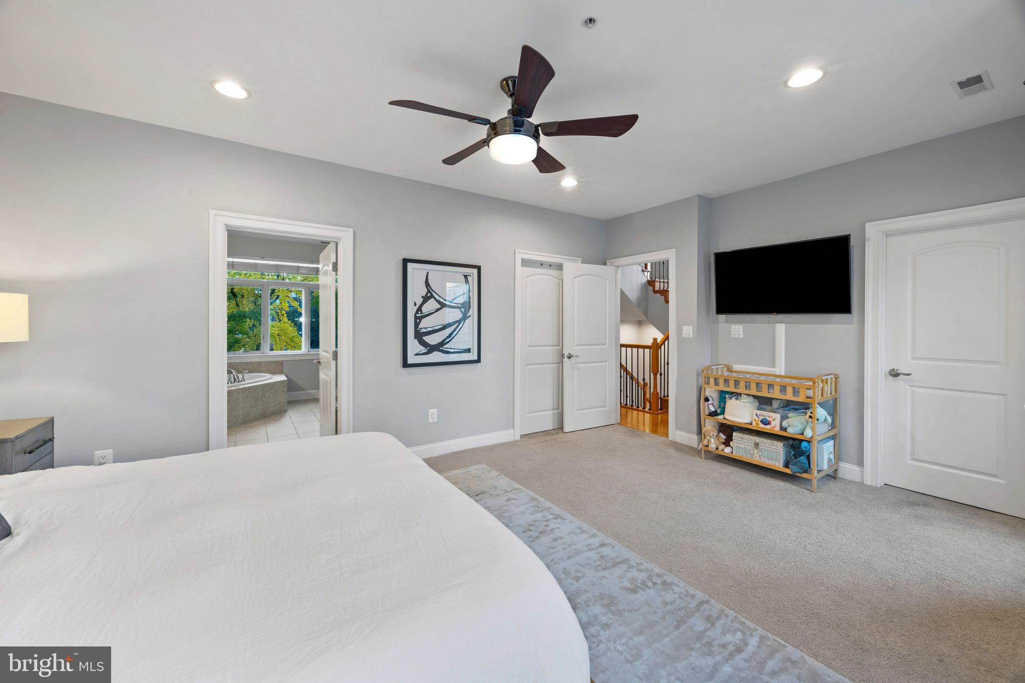 900 Valencia Court, Unit 188 Baltimore, MD 21230 - Photo 34 of 62 a bedroom with a bed and a flat screen tv