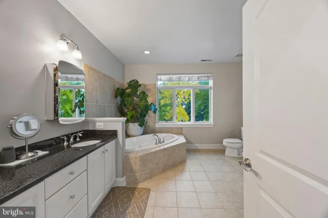 a bathroom with a shower and a bath tub