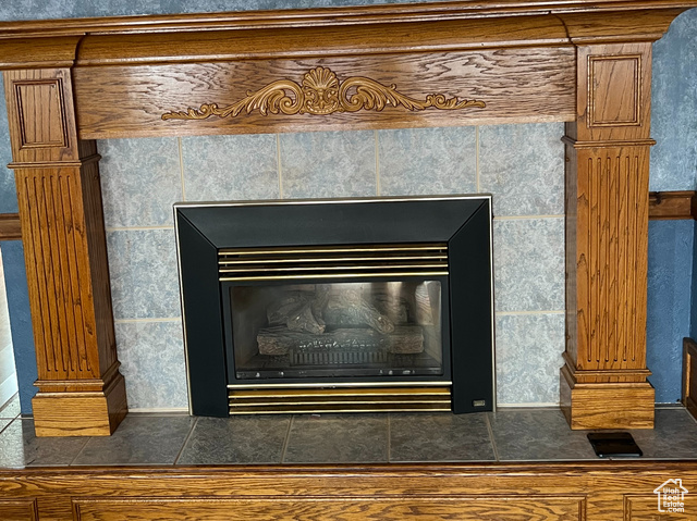 108 South Road Montpelier, ID 83254 - Photo 5 of 36 Detailed view of a tiled fireplace and wood finished floors