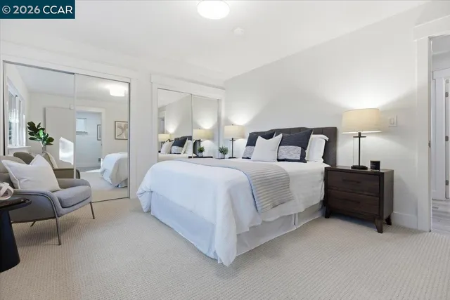 a bedroom with bed and a table